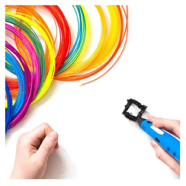 Child draws 3Dpen. Colorful rainbow plastic filaments for 3D pen laying on white. New toy for child.